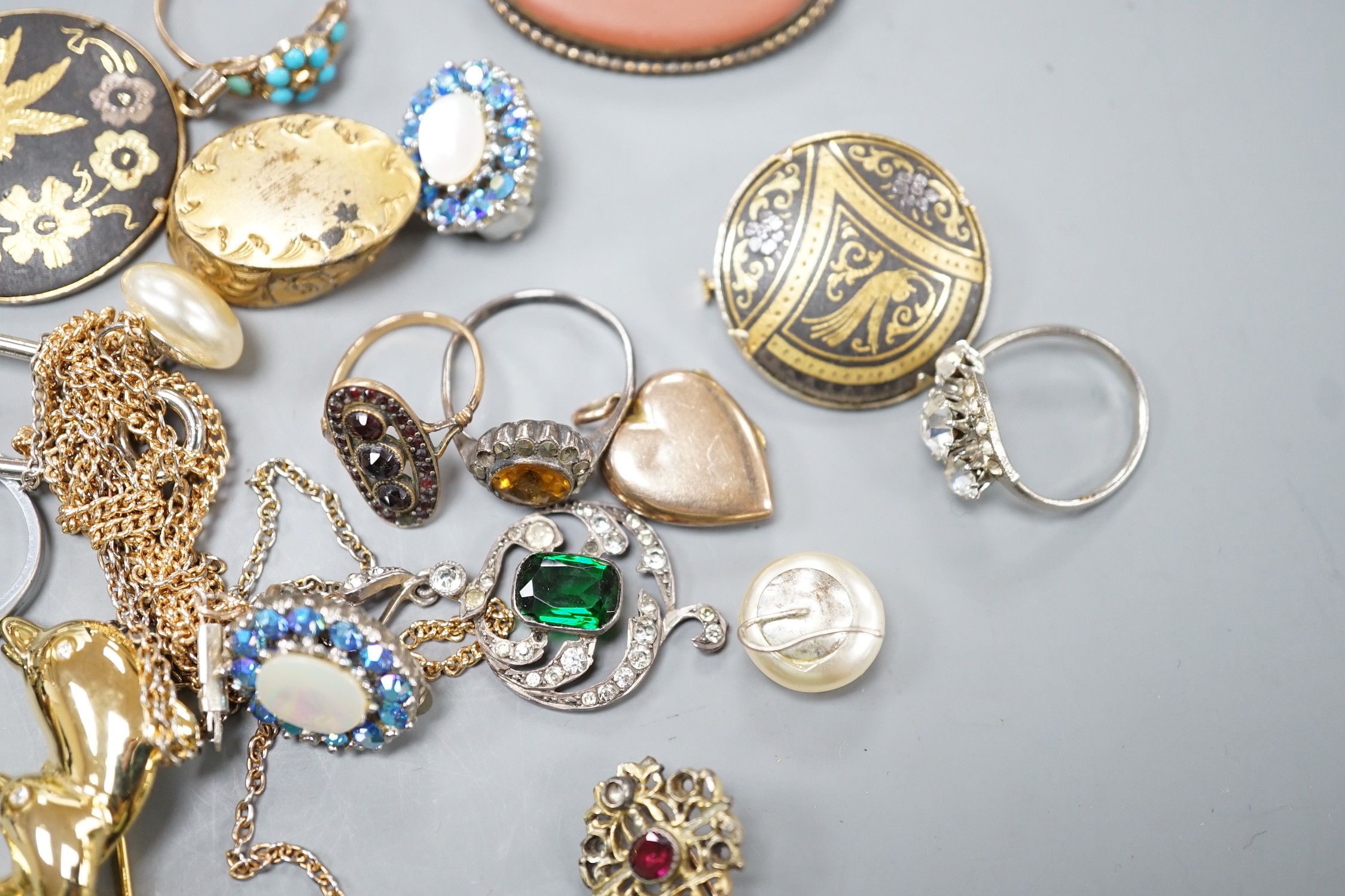 A yellow metal and turquoise cluster set dress ring(stone missing), a similar seed pearl set heart shaped locket and a group of assorted costume jewellery.
